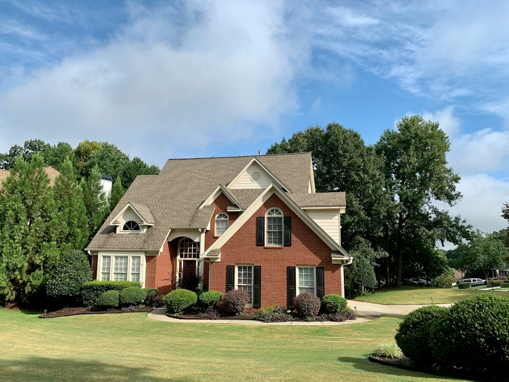 A brick house with a new roof